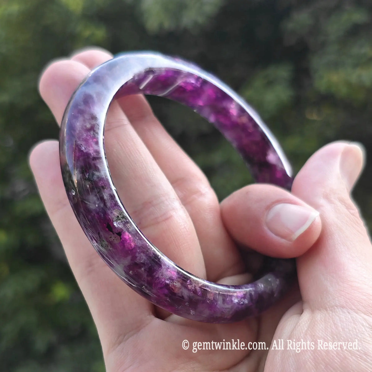 Detailed shot of natural purple lepidolite gemstone bangle perfect for retail stores and spiritual wellness gifts