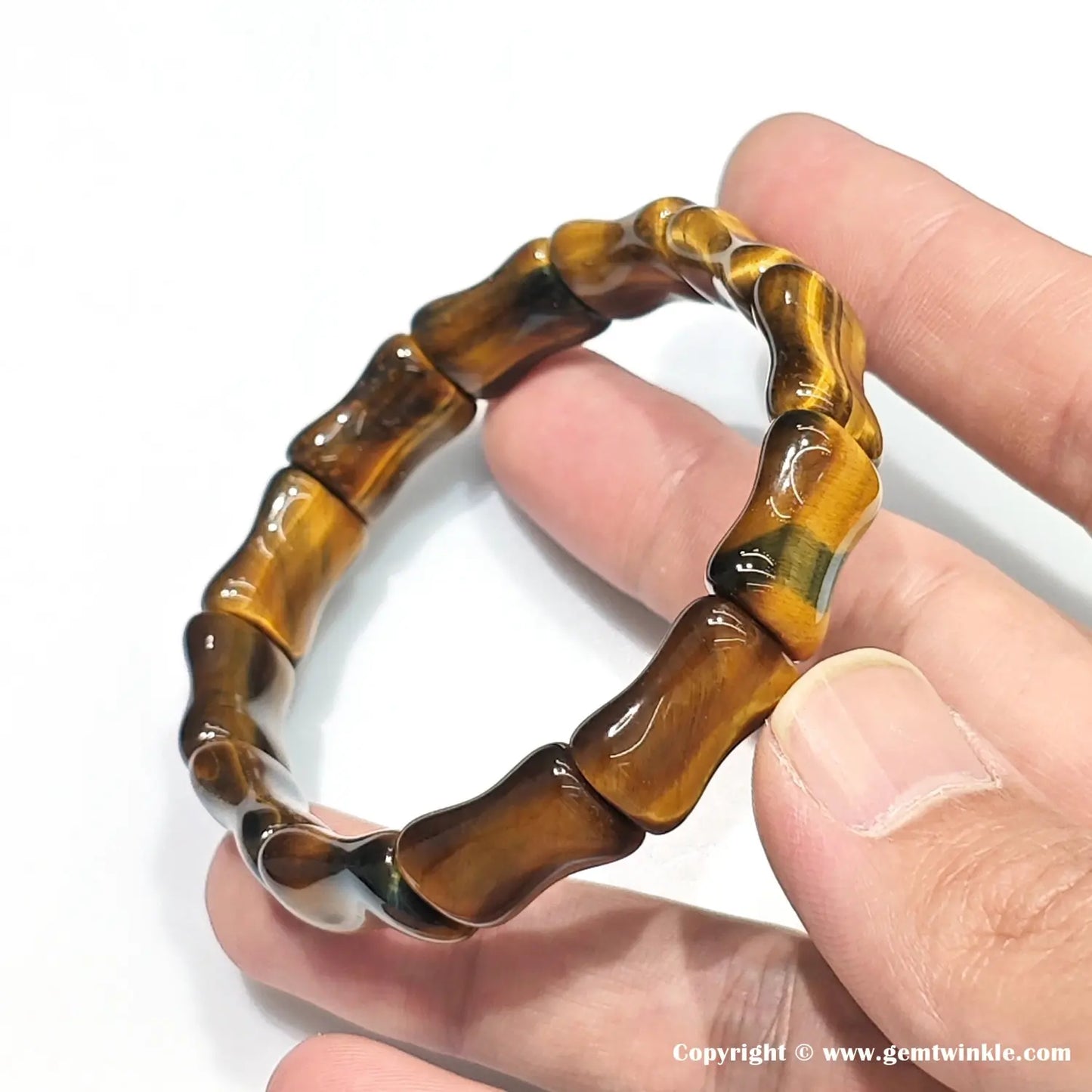 Detailed view of 15mm golden tiger eye bamboo segments showing natural banding and polished ridges — women's bracelet for everyday wear, stackable design