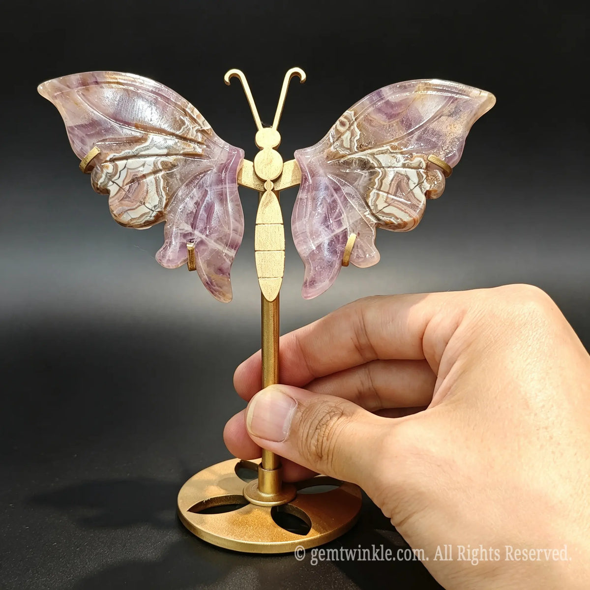 Carved natural purple agate butterfly gemstone figurine with rich purple banding patterns