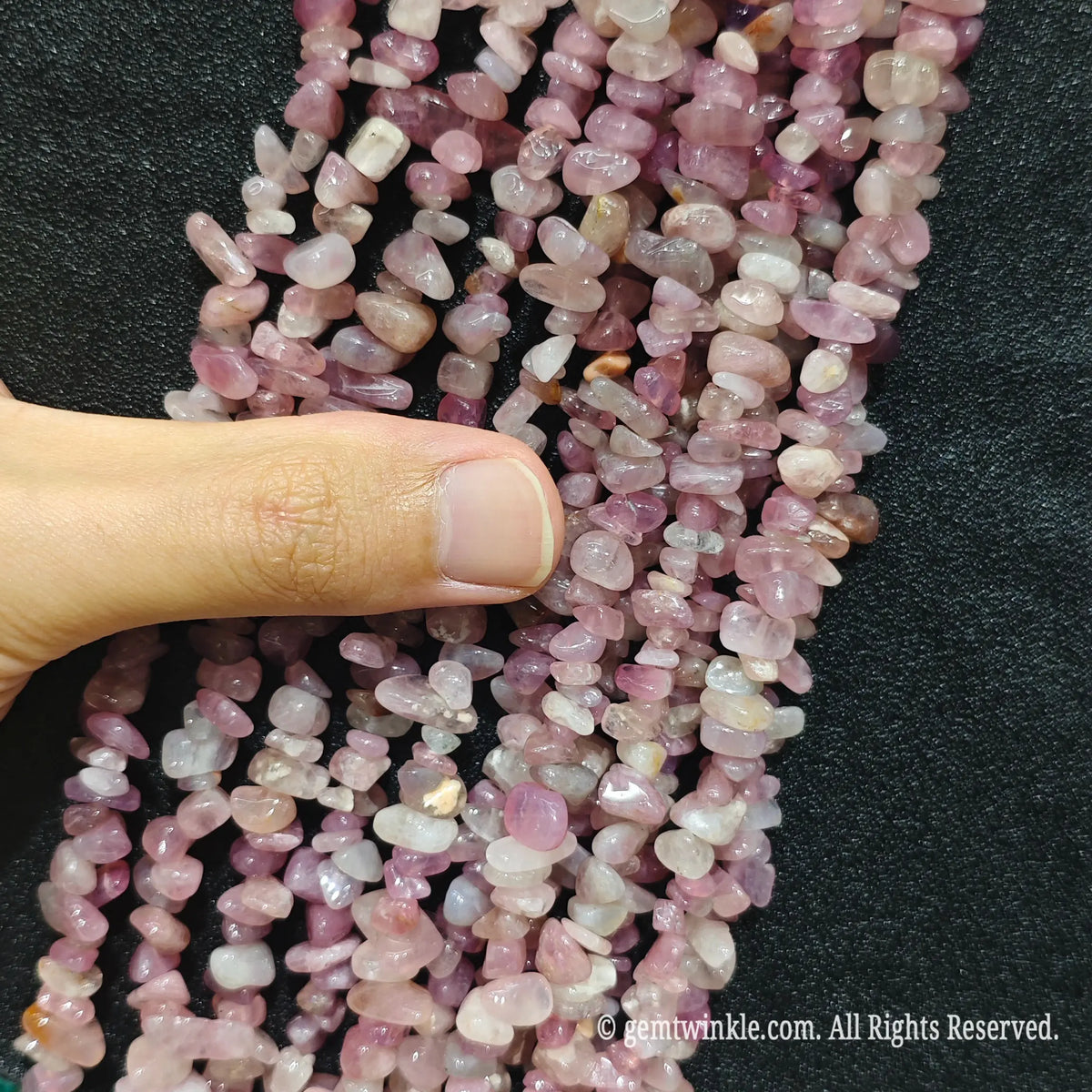 Detailed view of long 75cm natural purple pink quartz chipped strand ready for DIY projects