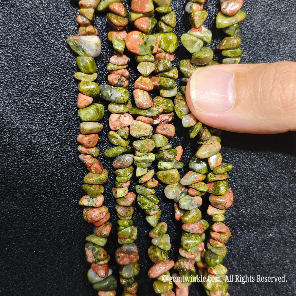 Detailed view of long 75cm natural unakite chipped strand ready for DIY jewelry projects