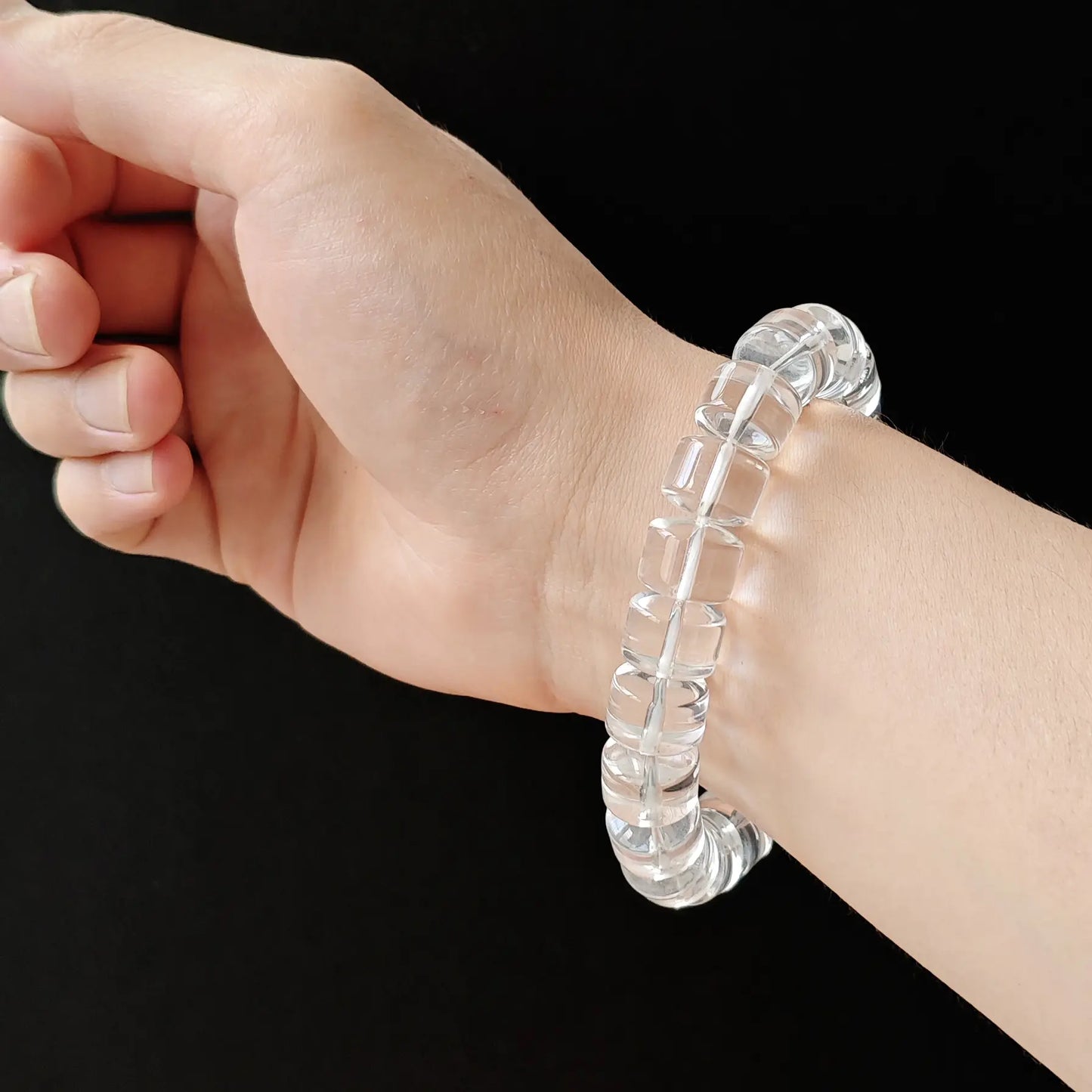 Clear quartz rondelle handchain on wrist—subtle elegance, comfortable drape, ideal for layering or minimalist styling