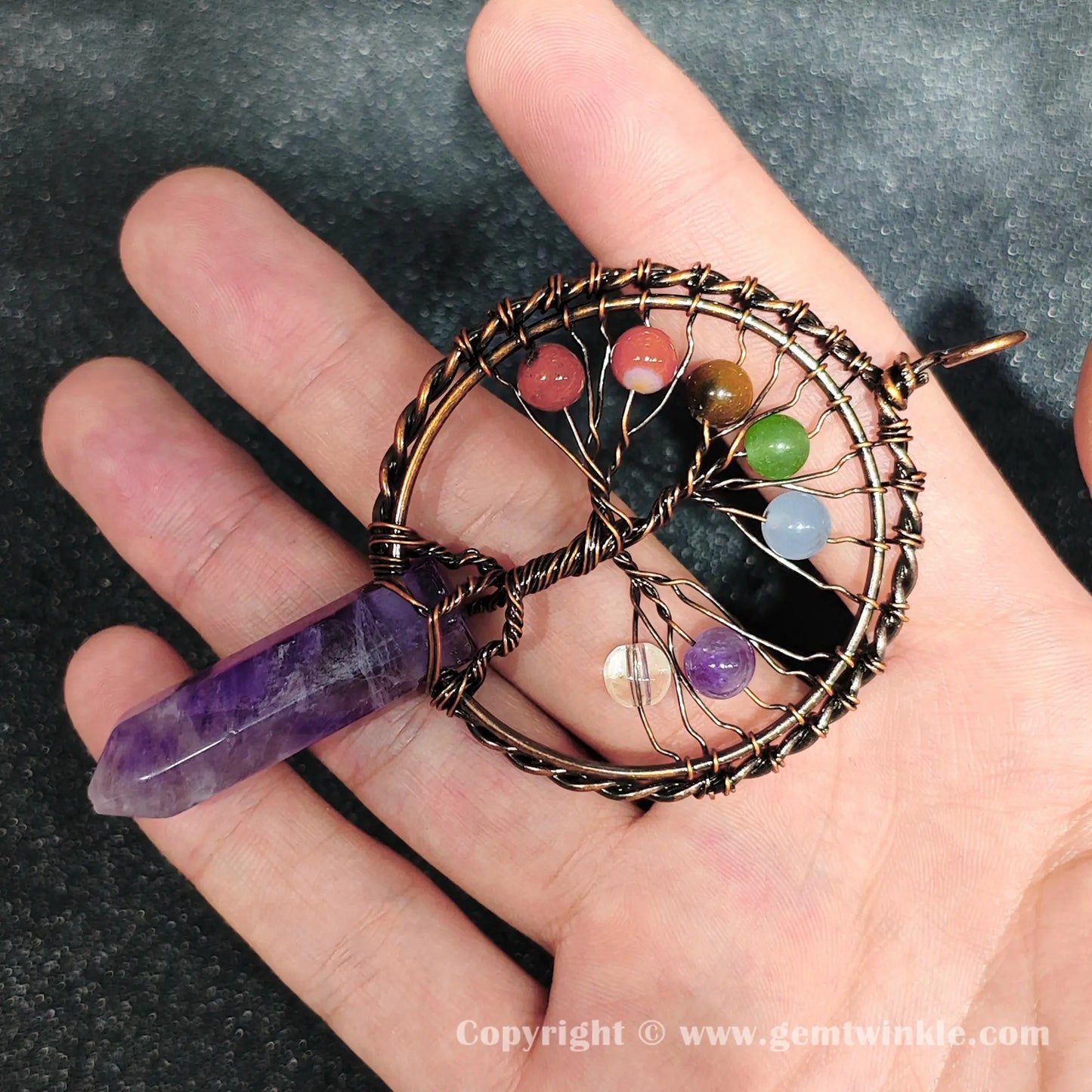 Angled hand preview of 8cm wire wrapped amethyst hexagon point pendant for jewelry making