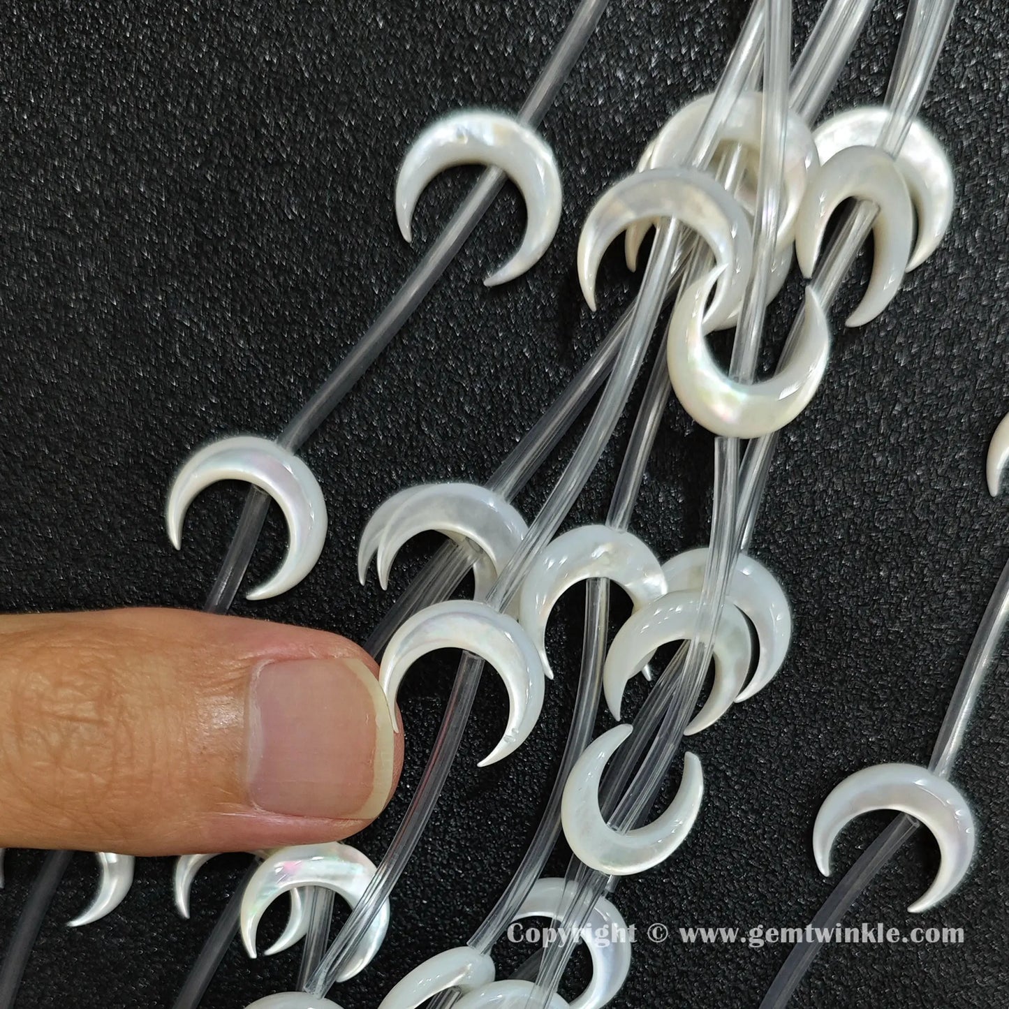 Handheld preview showing 14mm white mother of pearl moon beads