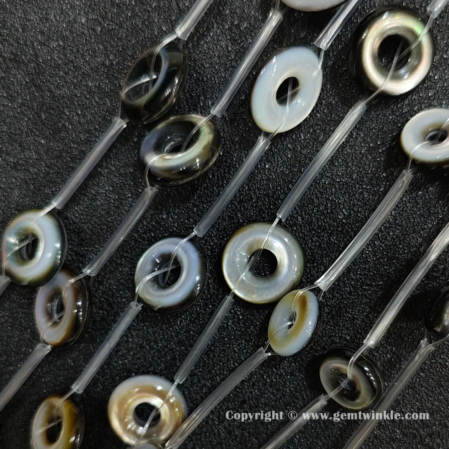 handheld preview of double sided laminated shell ring beads