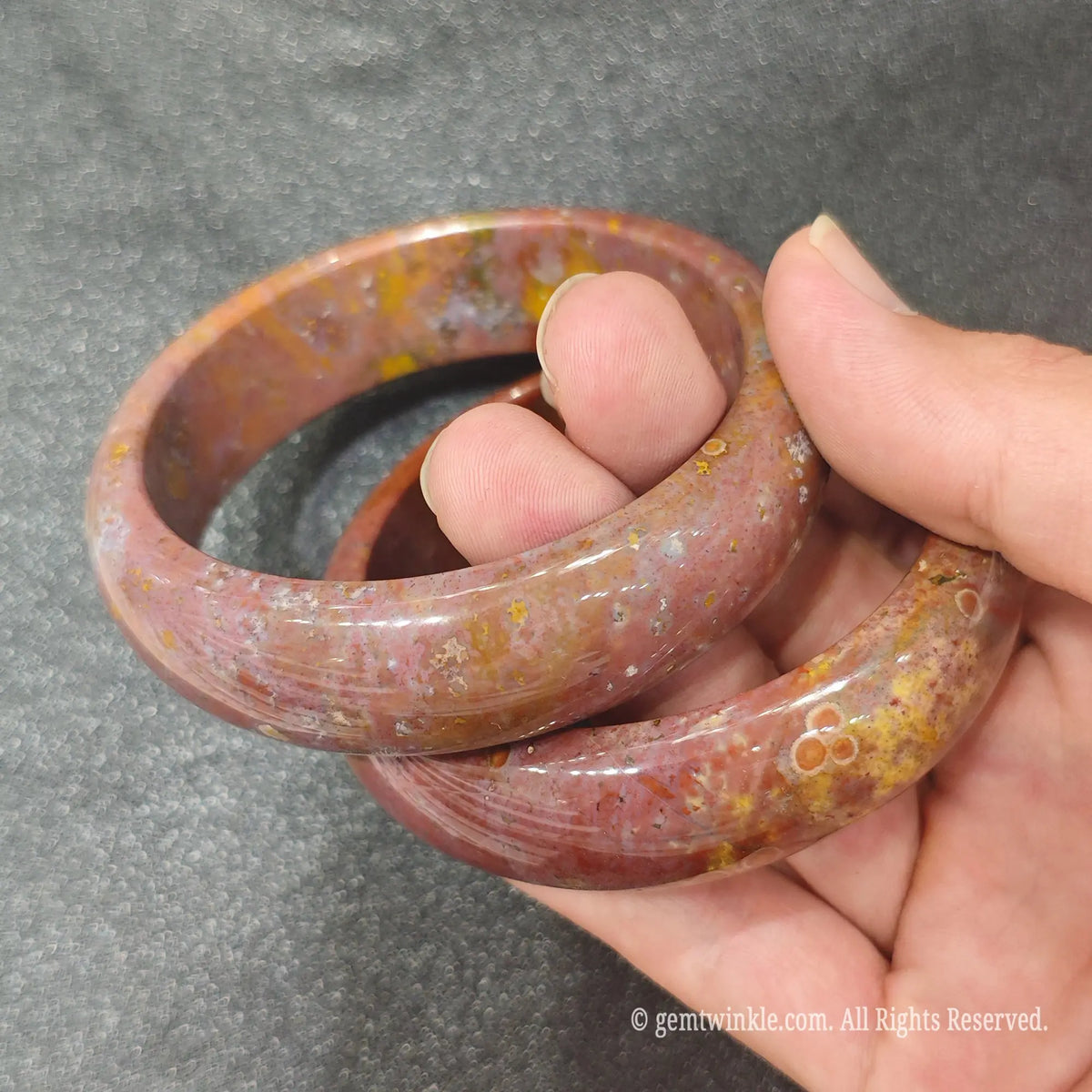 Natural Ocean Jasper bangles held together demonstrating genuine orbicular patterns and high gloss finish