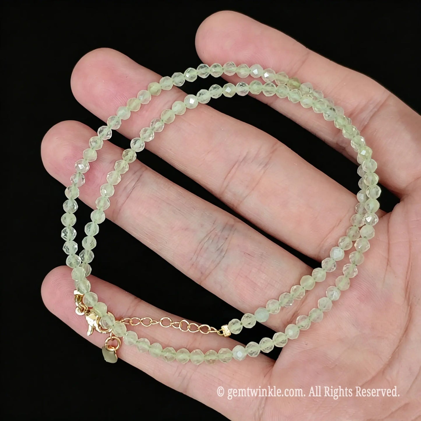 close up of gold lobster clasp and 5cm extension chain on prehnite necklace