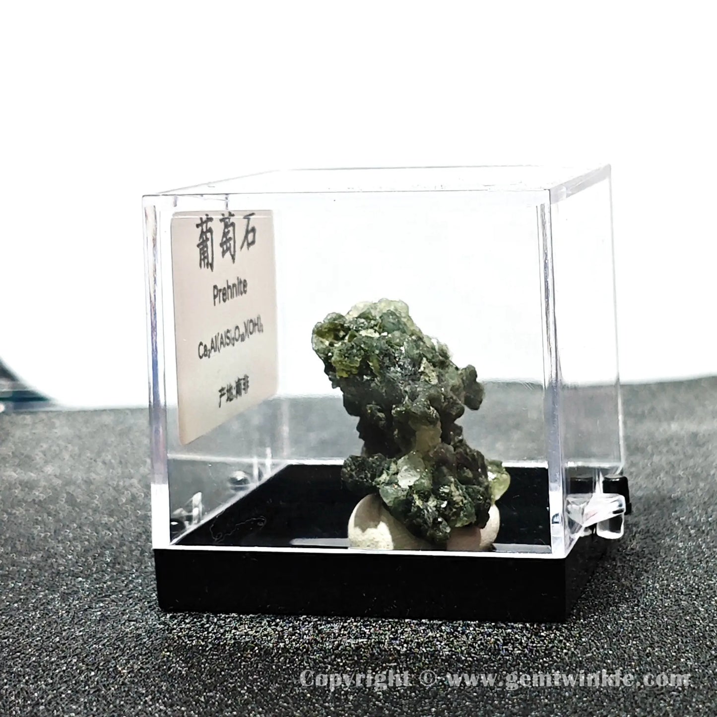 Angled right perspective highlighting globular prehnite aggregates and secure black base mount