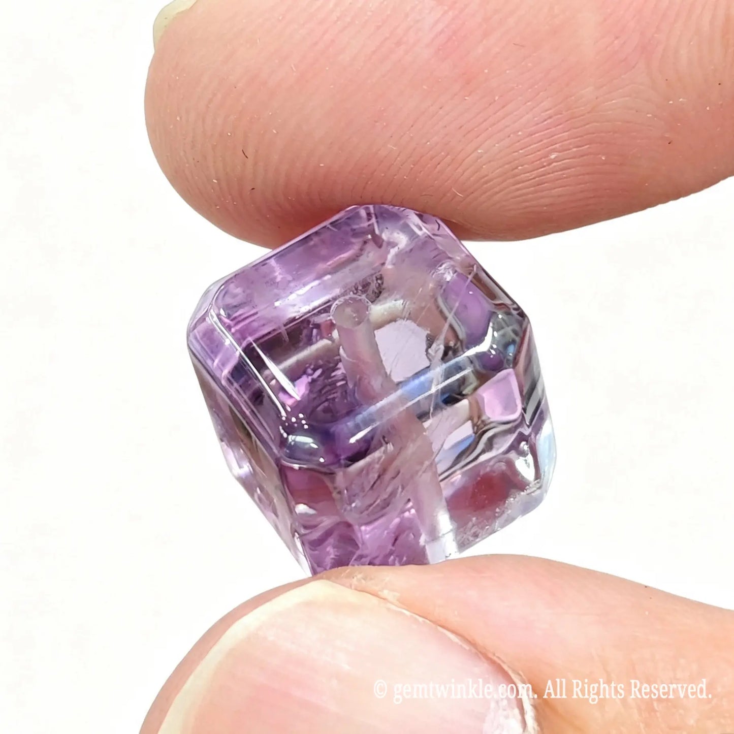 Close up preview of amethyst sugar cube bead showing internal natural veiling and smooth bevel corners