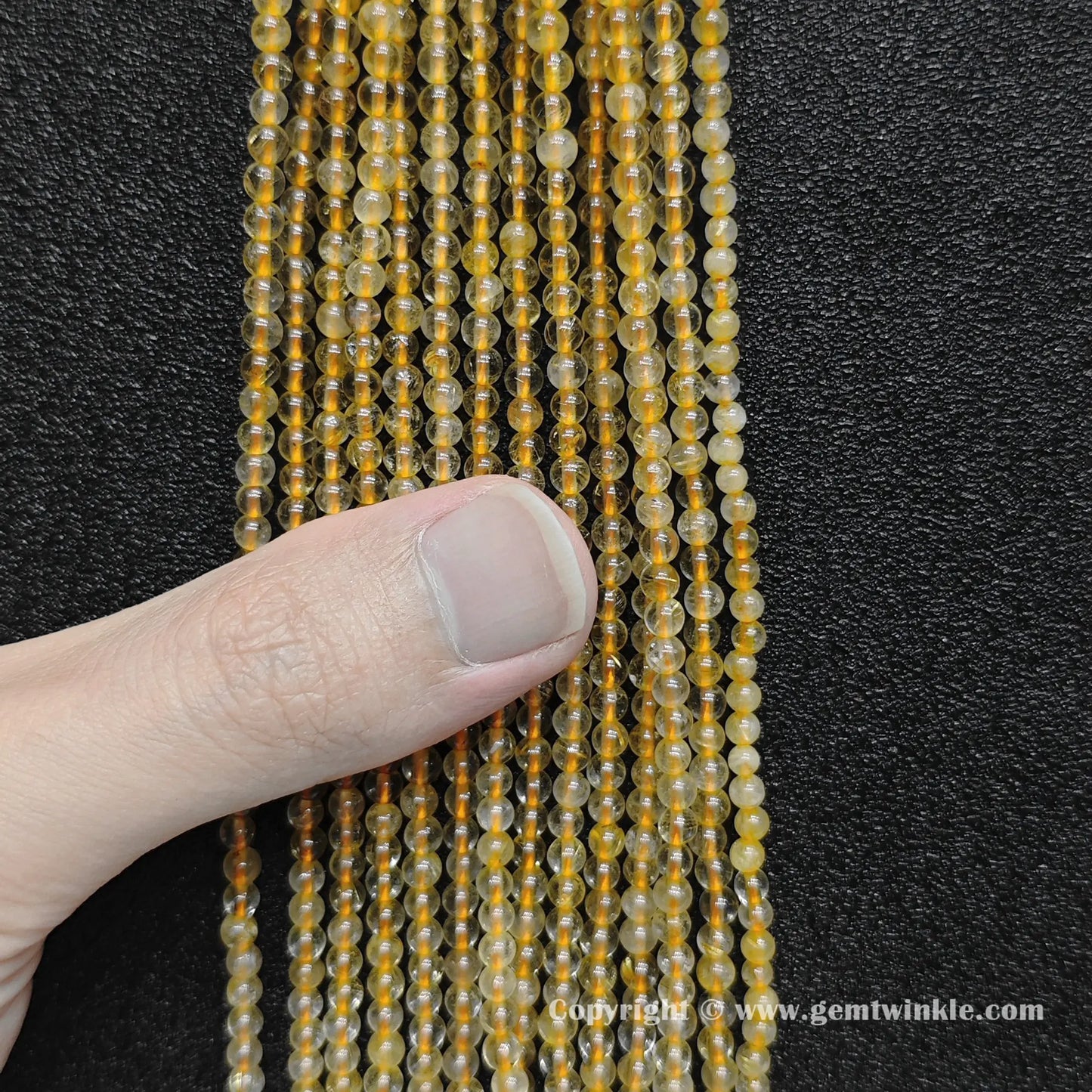 Bulk wholesale strands of 3mm small round gold rutilated quartz loose beads perfect for fine jewelry making and delicate stacking bracelets