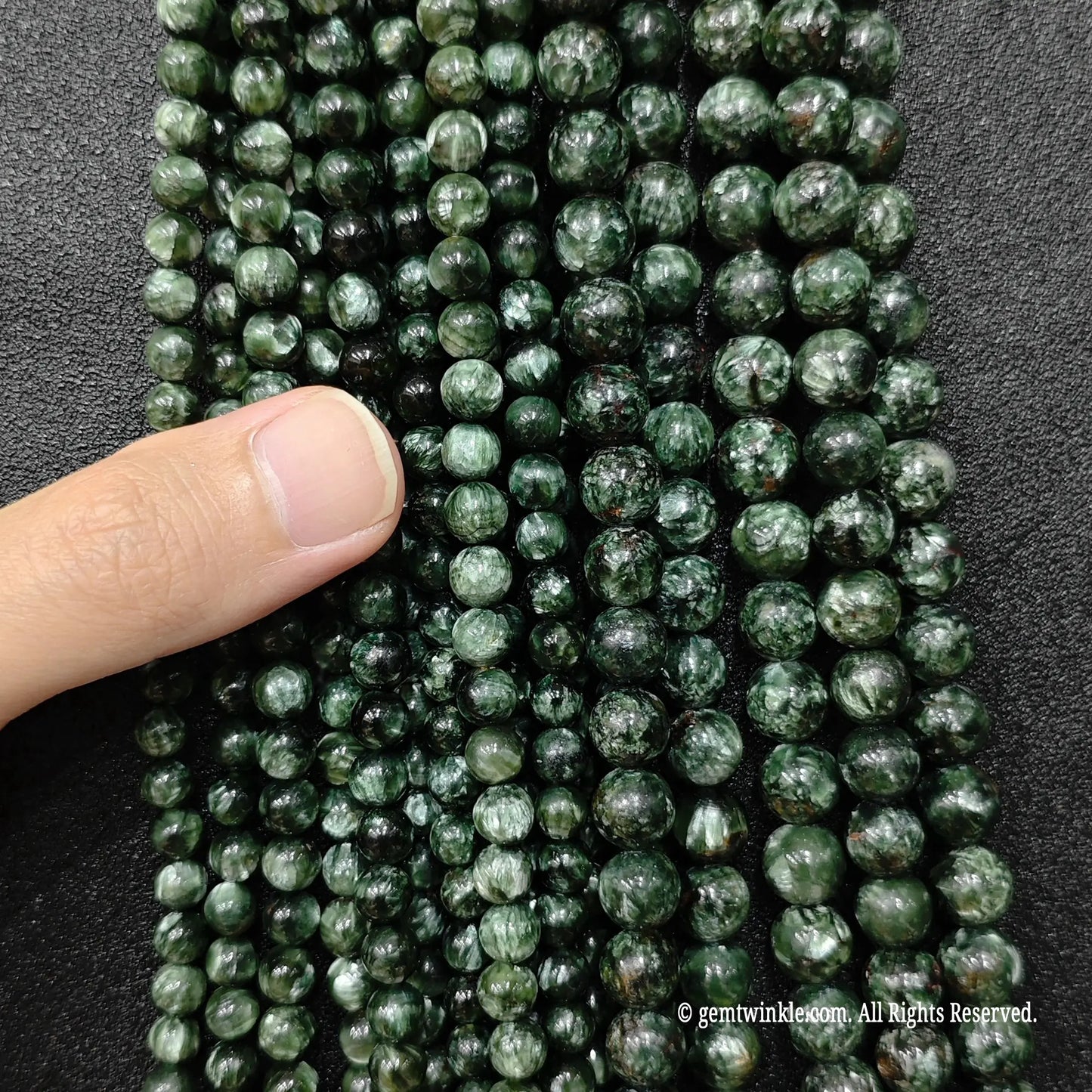 three-to-six-millimeter-dainty-green-crystal-beads-hand-display