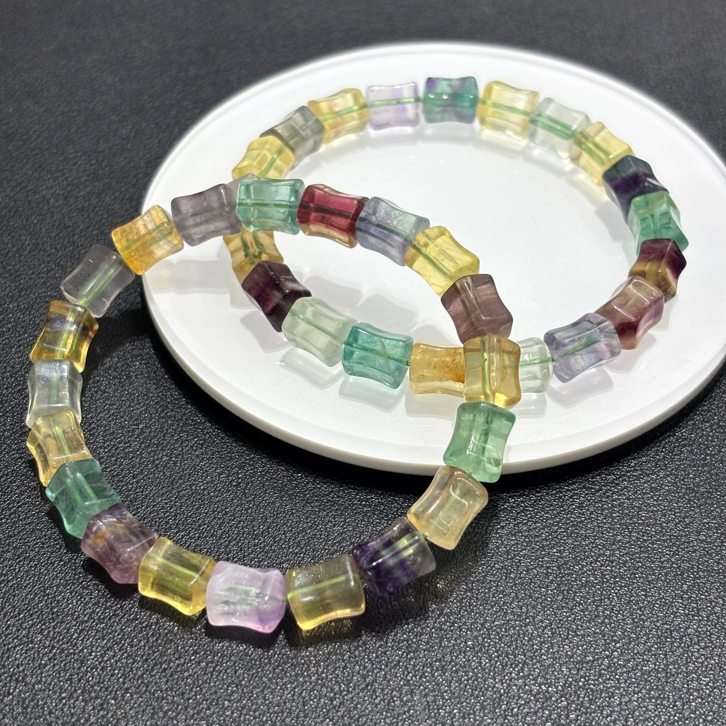 Top-down view of a fluorite bamboo bead bangle, emphasizing the geometric shape and the stretch elastic design for easy wear.