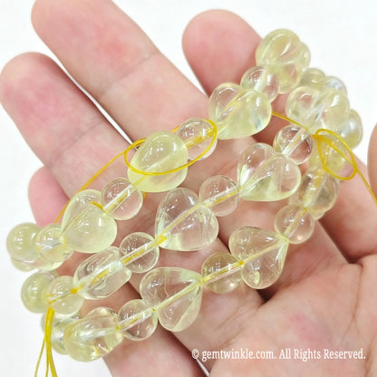 Preview of single-strand 12mm lemon quartz heart bead bracelet with round crystal spacers