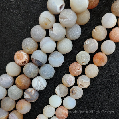 Boutique crystal supplies showing a premium batch of hand selected 12mm matte druzy agate geode strands for small wholesale buyers