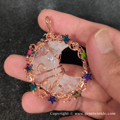 Handheld preview of 50mm celestial wire wrapped quartz crescent moon pendant with rainbow stars