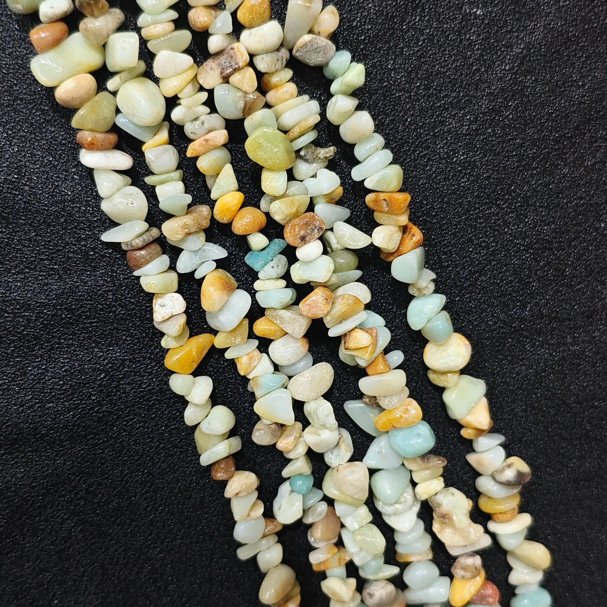 Multiple strands of natural amazonite 5-10mm irregular blue-green and yellow chip beads for jewelry crafting[cite: 6]