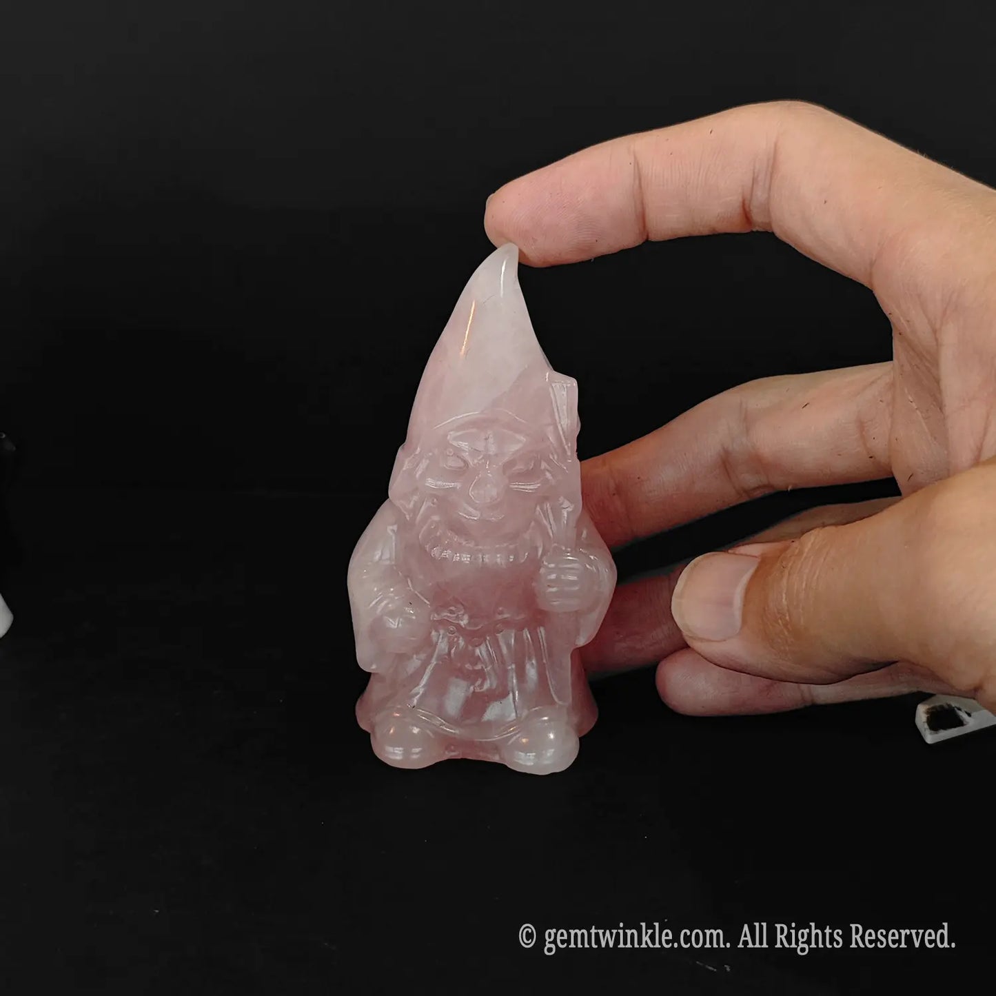 8cm pink rose quartz gnome statue showing natural mineral inclusions and lines