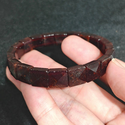 Almandine Garnet Pyramid Plate Bead Close Up on Hand