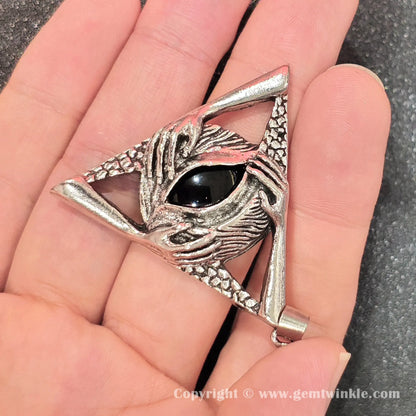 Angled perspective showcasing polished black obsidian shine and top attachment bail