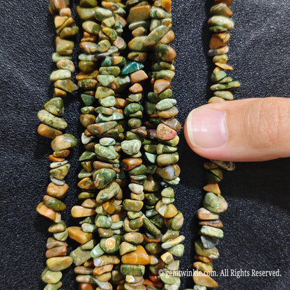 Detailed view of 75cm long natural australian jade tumbled chipped gemstone strand for jewelry DIY
