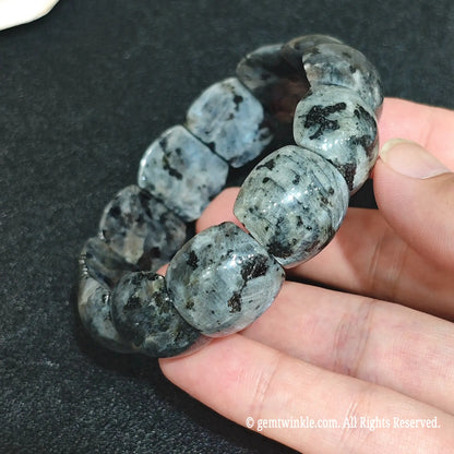 Black Labradorite Barrel Bead Strands Close Up on Hand
