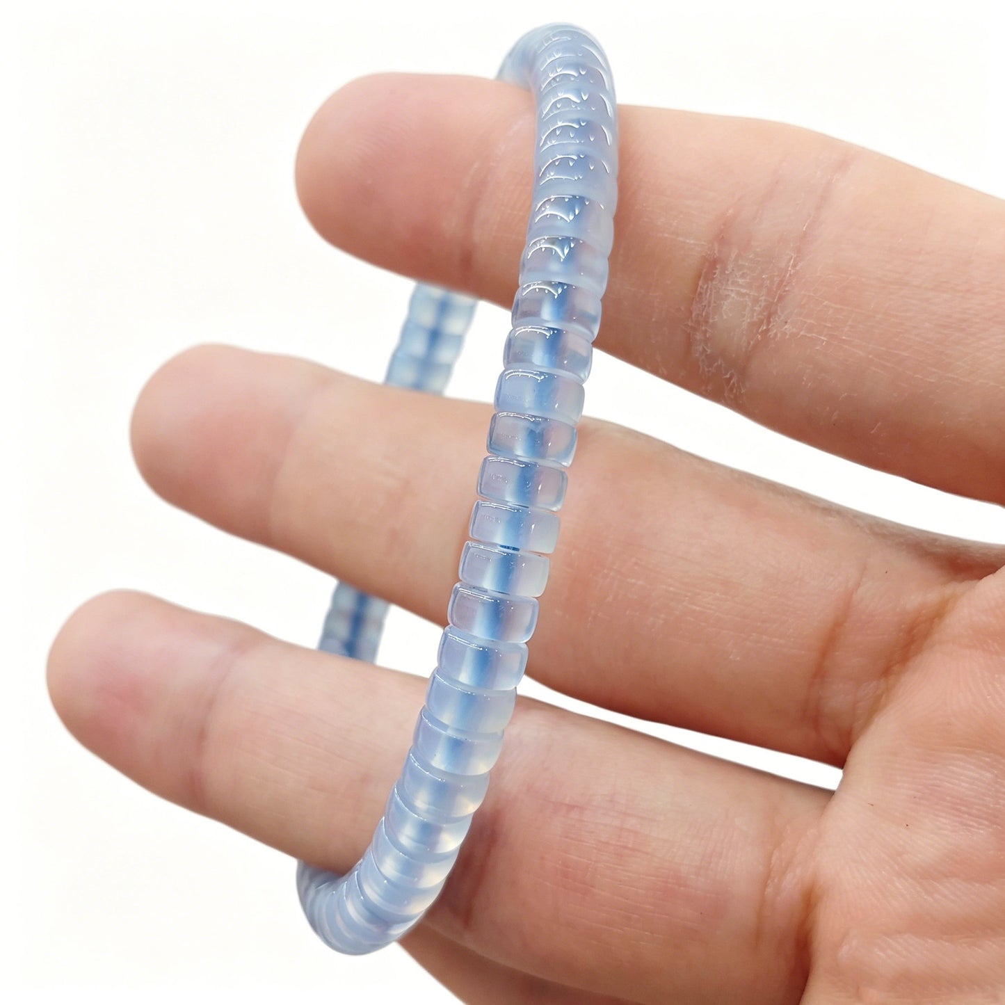 Serene sky blue agate tablet bracelet worn on wrist; gentle luster and calming tone visible under natural light