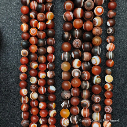 Bulk assortment of red dzi agate crystal beads
