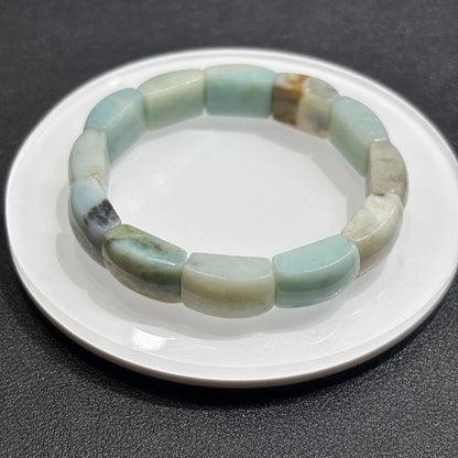 Overhead view: natural caribbean calcite square beads in full circle; elastic cord hidden, ideal for daily mindful wear