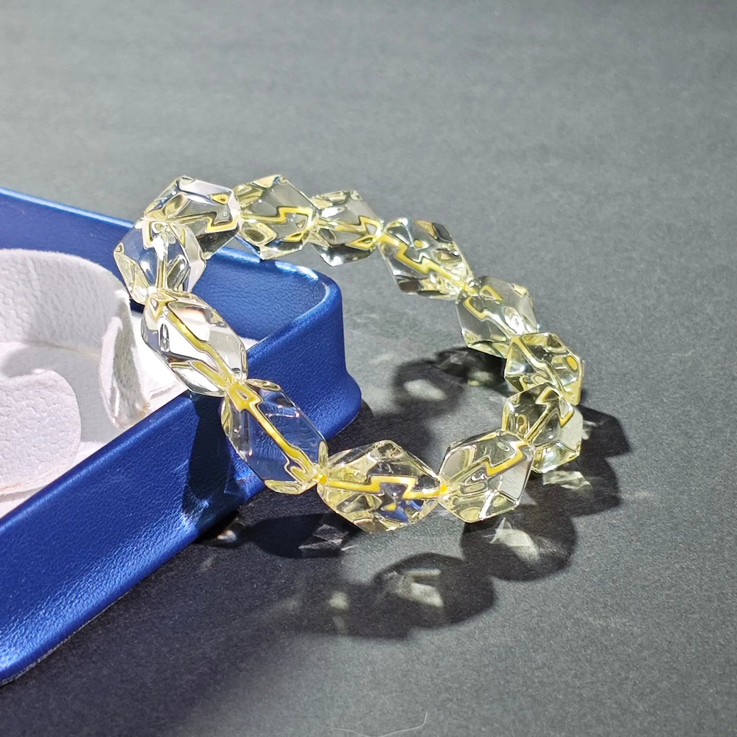 Lemon yellow citrine faceted bracelet displayed beside elegant blue gift box—ready for gifting