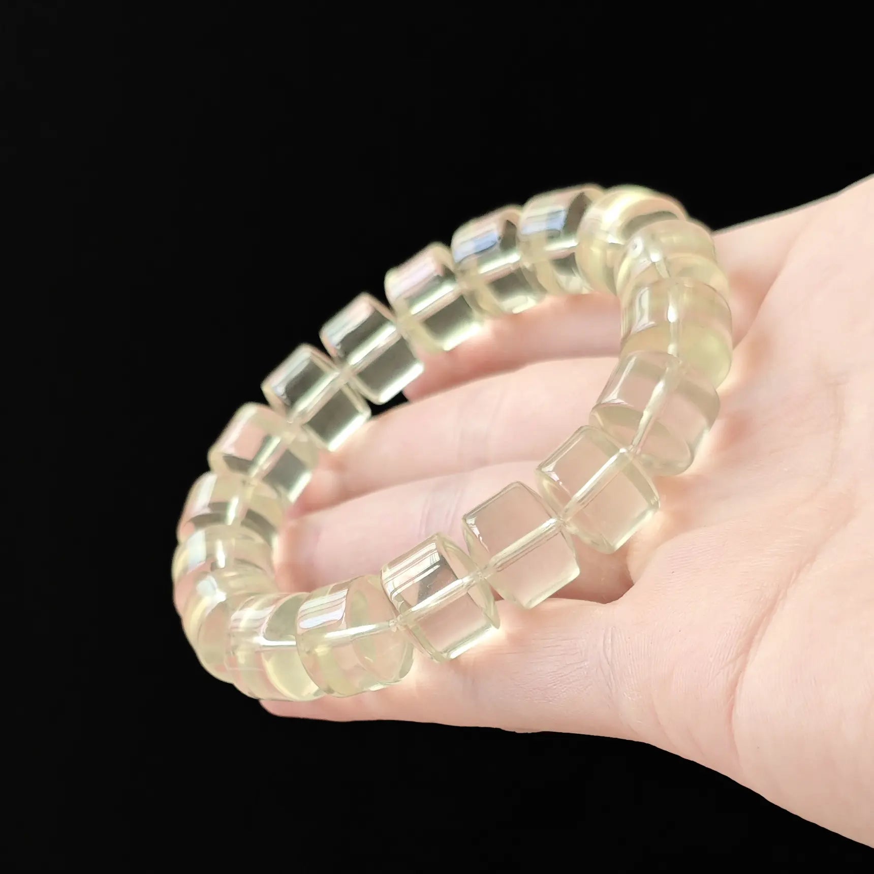 Citrine wheel bracelet gently curved—highlighting the distinctive wheel shape, even color saturation, and elastic flexibility