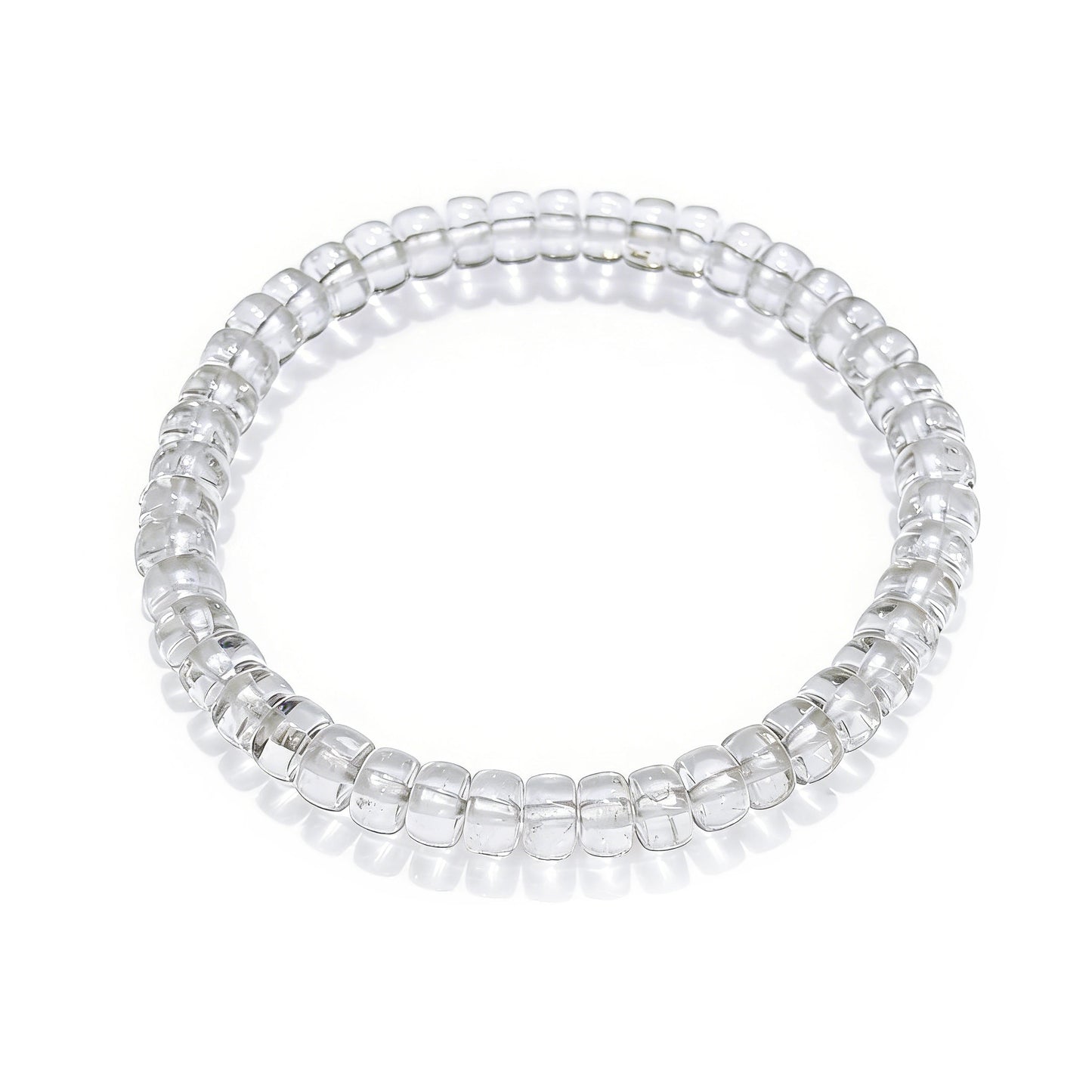 Transparent natural clear quartz disc bead stretch bracelet displayed on white background, smooth polished surface, no clasp