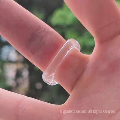 Detailed shot of high clarity rock crystal fluted ring demonstrating clean edge finish and light refraction