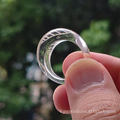 Natural clear quartz solid band ring styled on hand displaying minimalist fashion jewelry look