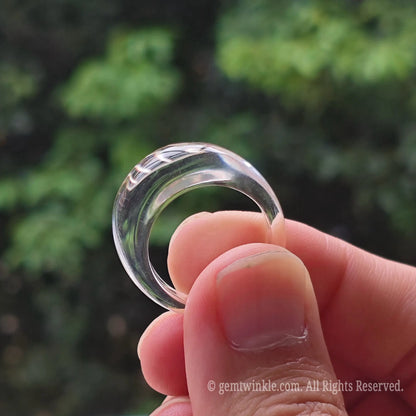Detailed shot of high clarity rock crystal ring demonstrating clean edge finish and light refraction