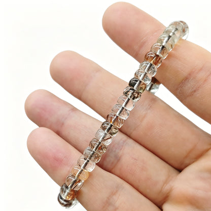 Serene clear quartz tablet bracelet laid flat—showing smooth finish, consistent shape, and gentle luster under studio light