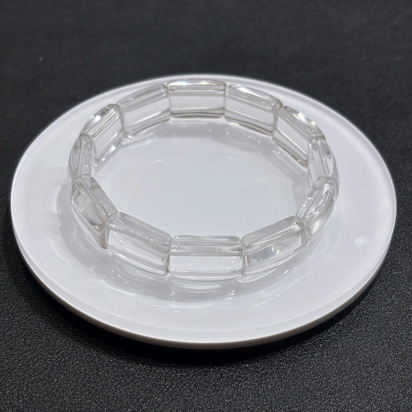 Close-up of natural clear quartz square tablet beads, showcasing transparency and subtle internal inclusions