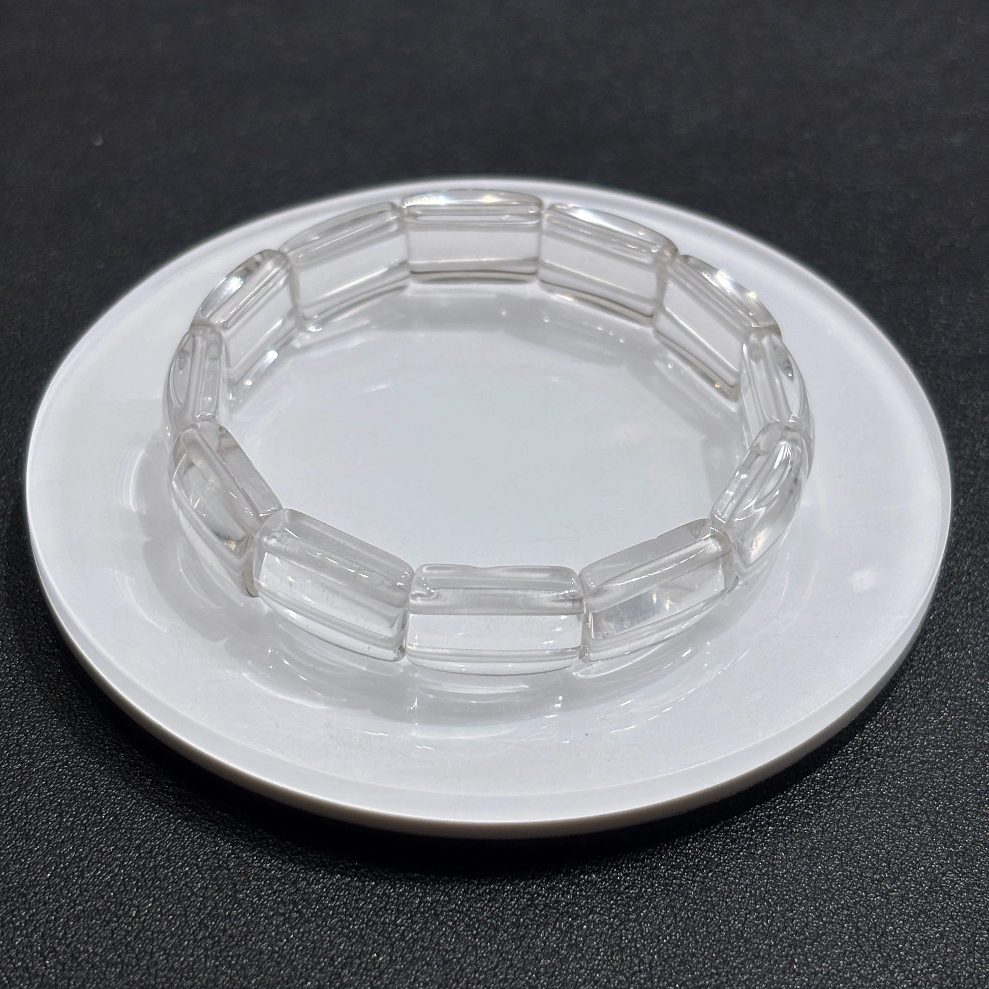 Close-up of natural clear quartz square tablet beads, showcasing transparency and subtle internal inclusions