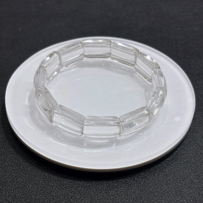 Close-up of natural clear quartz square tablet beads, showcasing transparency and subtle internal inclusions