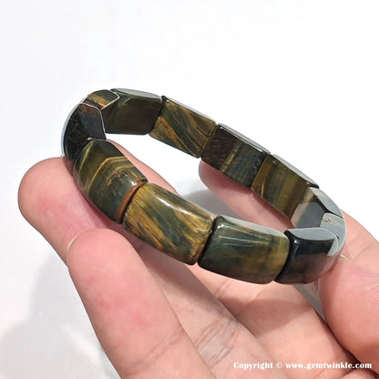 Macro view highlighting the precise beveled edges and natural chatoyant banding of the ~16mm rectangular tiger eye beads, designed for both men and women.