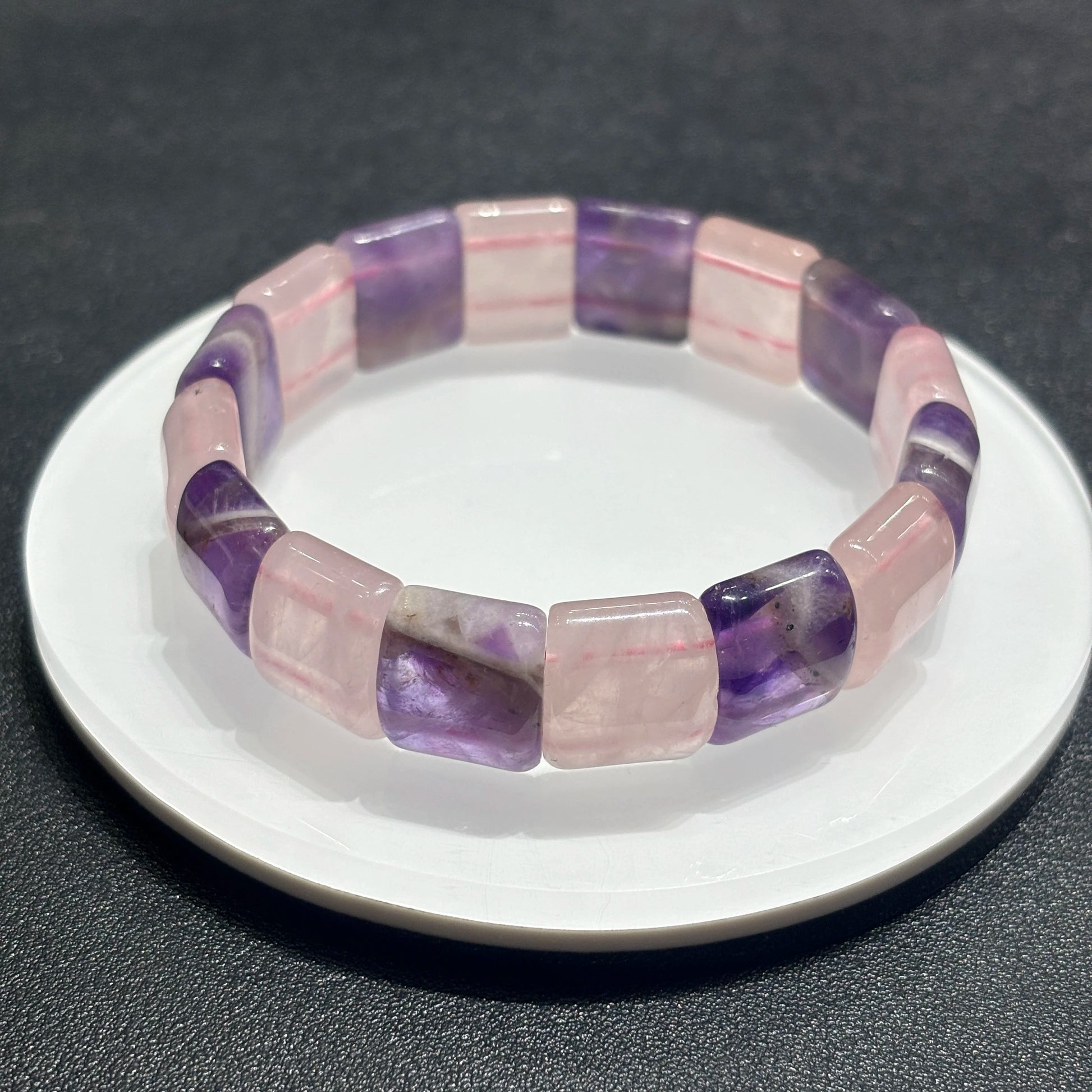 Macro detail of amethyst and rose quartz rectangular slab beads