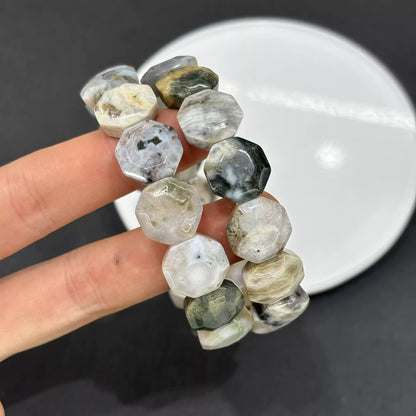 Close-up of natural Ocean Jasper’s orbicular patterns and faceted surfaces—each bead unique due to geological formation