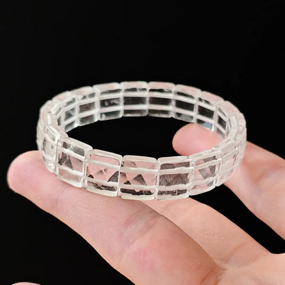 Women’s clear quartz faceted bead handchain held flat—showing precise cuts, clean edges, and transparent clarity