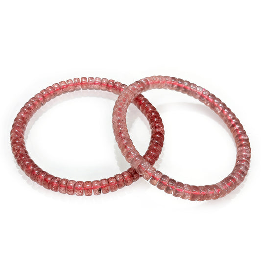 Natural faceted strawberry quartz cylindrical bead bracelet with pink hue and iron oxide flecks; double-stack style, 16cm stretch for delicate wear