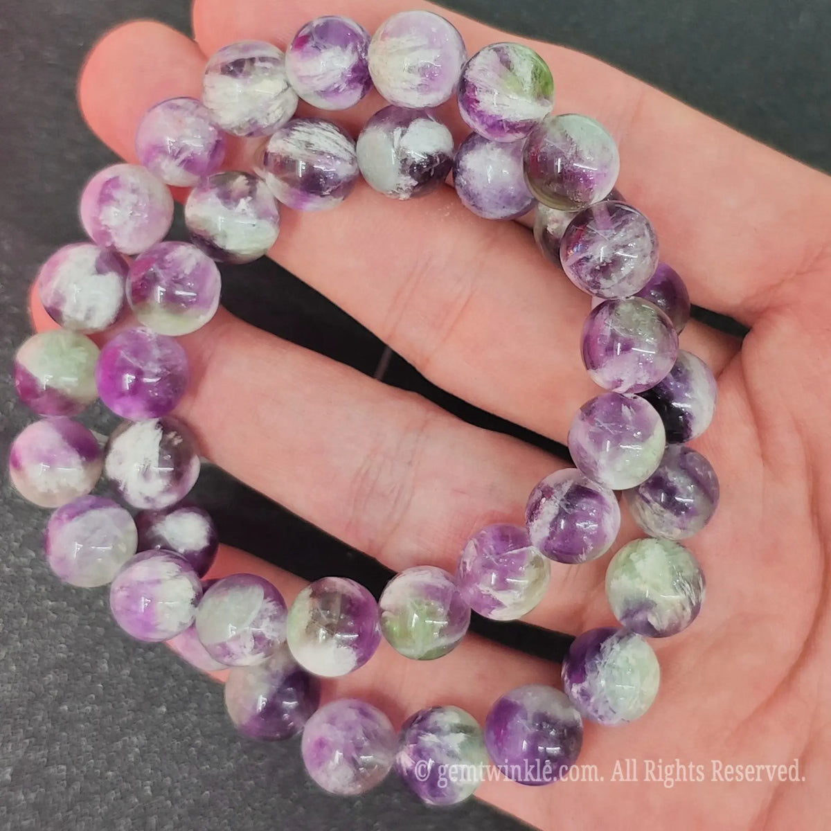 Double strands of natural feather fluorite crystal bracelets showcasing purple and green color zones