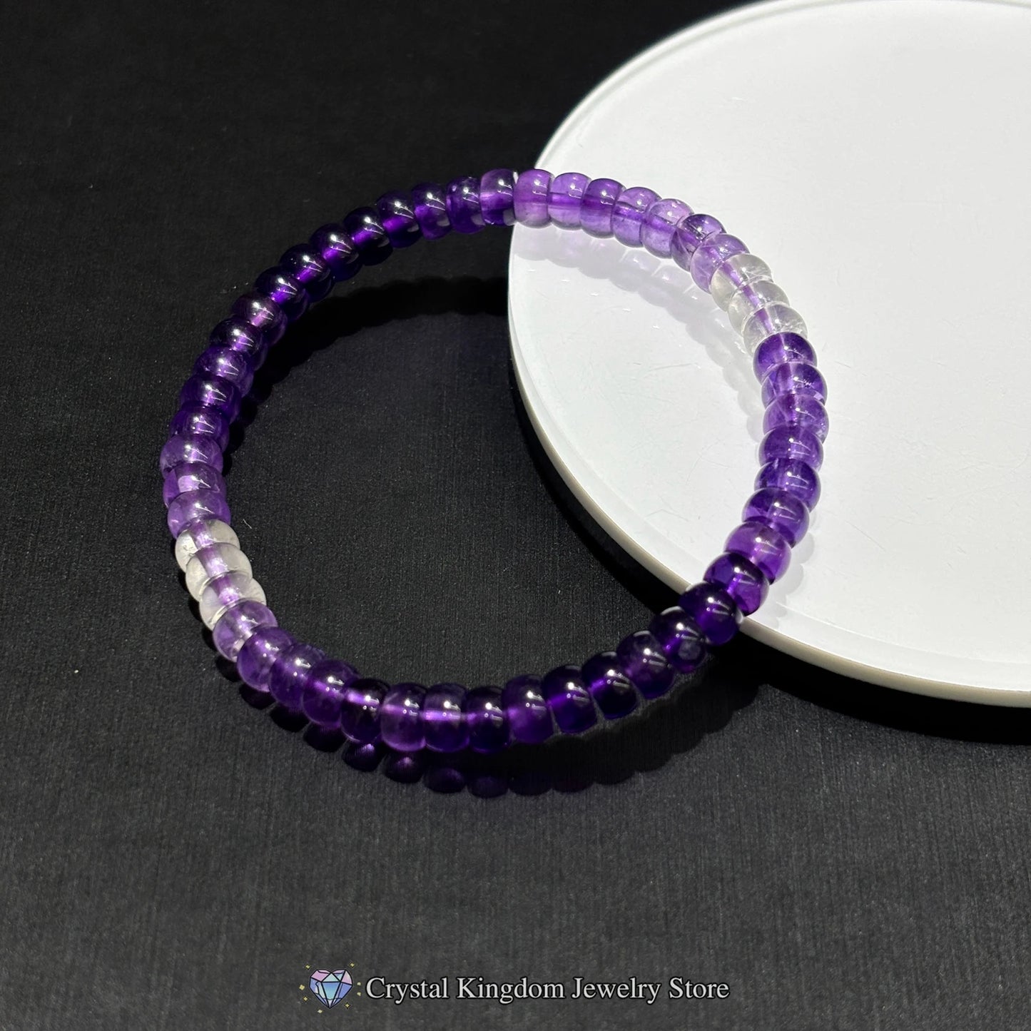 Side view of natural amethyst disc bead bracelet showing tablet-cut geometry and smooth edges; 17cm fit for average wrist