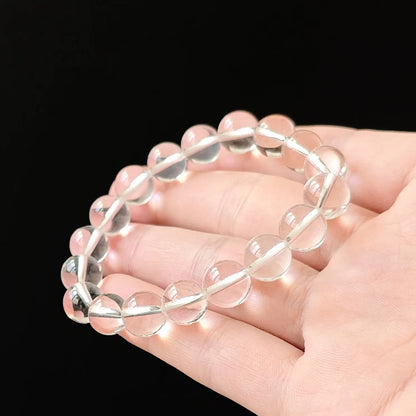 Flexible stretch bracelet made of premium natural clear quartz, smooth surface and uniform size, ideal for crown chakra alignment and mental clarity support
