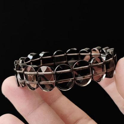 Flexible stretch bracelet made of natural ice obsidian, showcasing its glass-like clarity and smooth surface; ideal for grounding, meditation, and subtle spiritual style