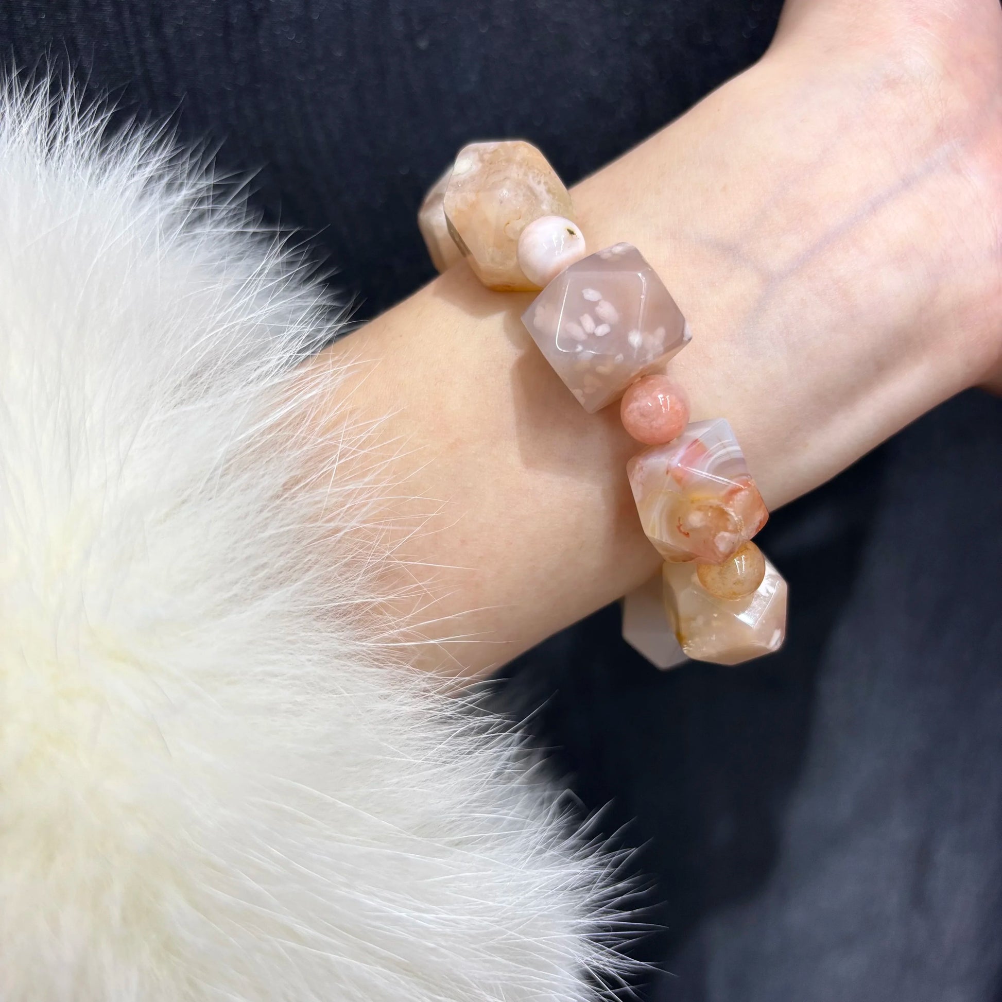 Woman wearing Natural Flower Agate Cherry Blossom Pattern Bracelet on wrist, showcasing spring trendy design and fit