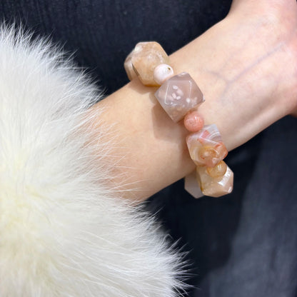 Woman wearing Natural Flower Agate Cherry Blossom Pattern Bracelet on wrist, showcasing spring trendy design and fit