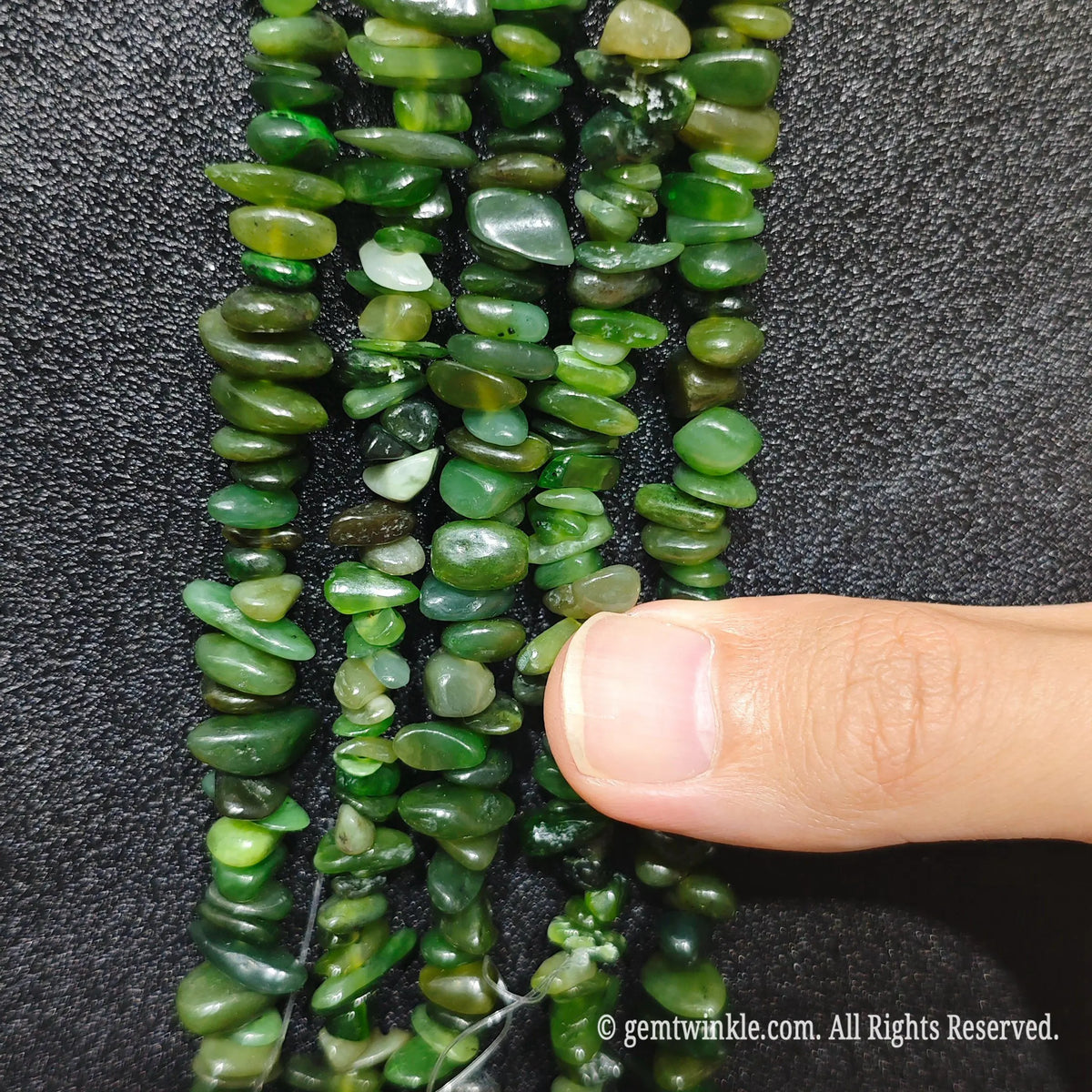 Detailed view of long 75cm natural hotan nephrite jade chipped strand ready for wholesale DIY projects